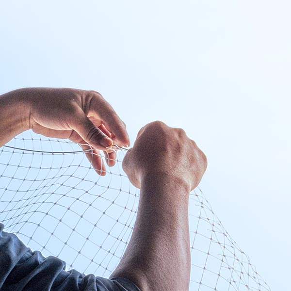 Discreet bird netting installed across a residential balcony